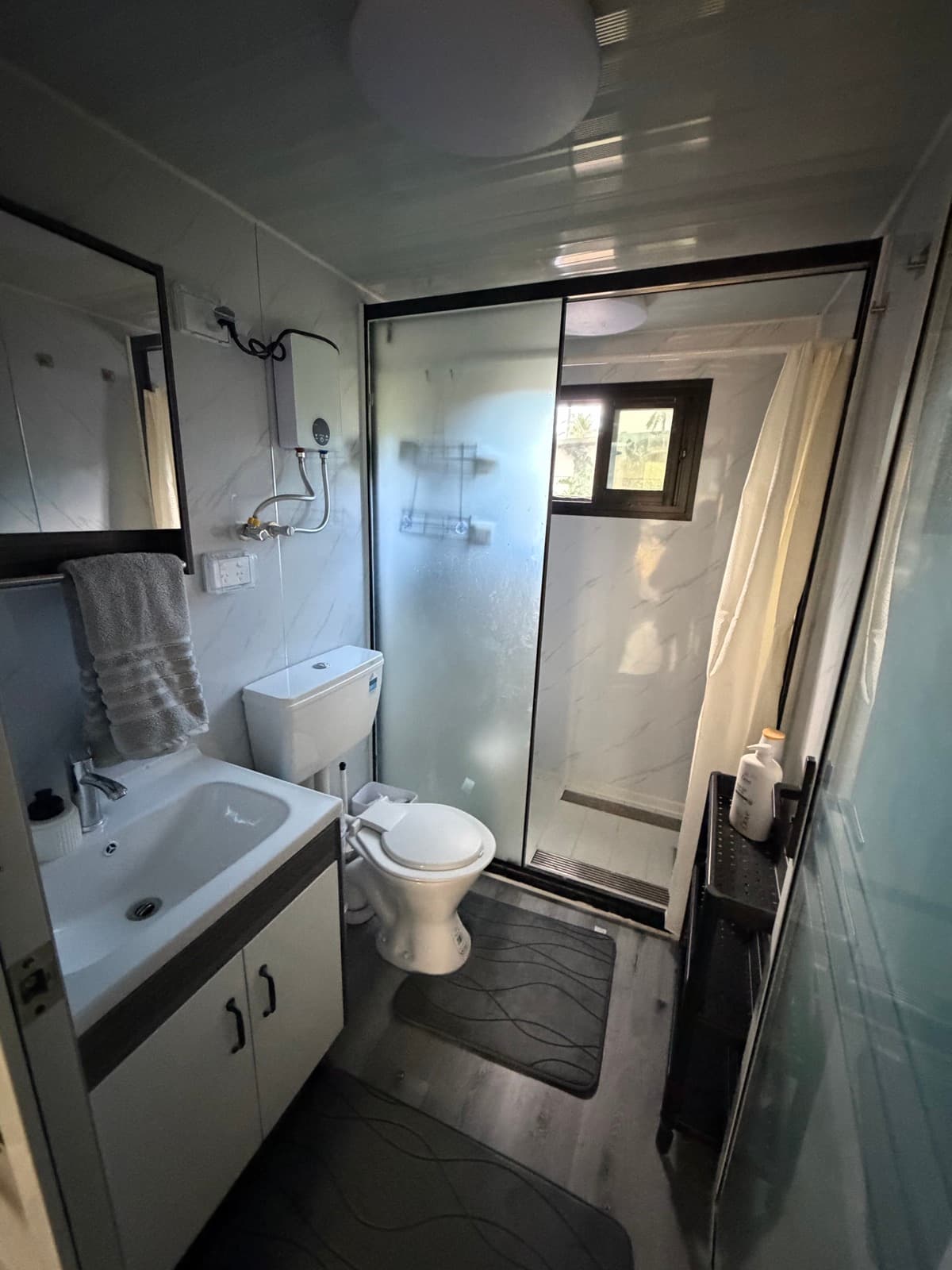 Bathroom with vanity and walk-in shower